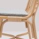 Détail du coussin sur la chaise en rotin SILLON