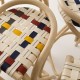Détail de l'assise tressée et sanglée multicolore du tabouret de bar en rotin design VIRAGE