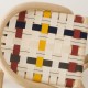 Detail of the woven seat with multicolore straps of the VIRAGE design rattan barstool