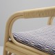 Détail du coussin du fauteuil en rotin design HUBLOT et coussin bleu Marquetry de Sunbrella