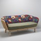 Canapé design BÔA avec structure en rotin et cannage, et tissu exotique Idris pour le dossier et vert clair pour l'assise